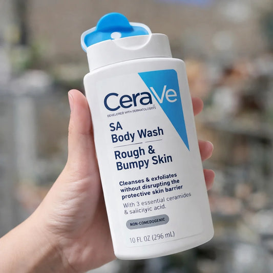 CeraVe SA Body Wash for Rough & Bumpy Skin held in a hand with a blurred background