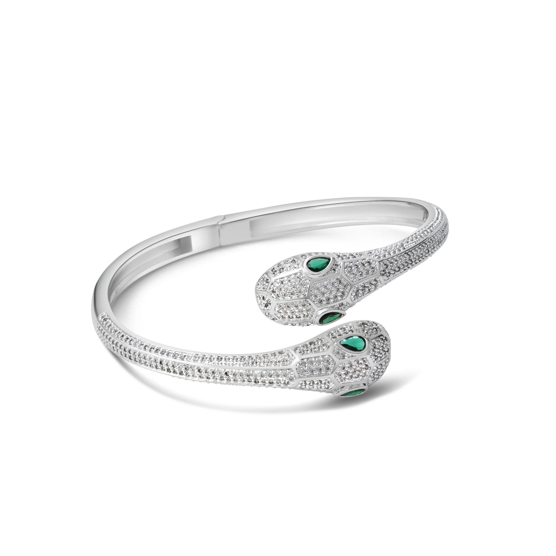 Silver bracelet with green gemstones on a white background