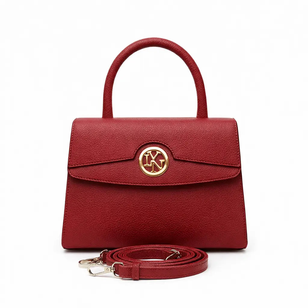 Red handbag with a gold emblem on a white background