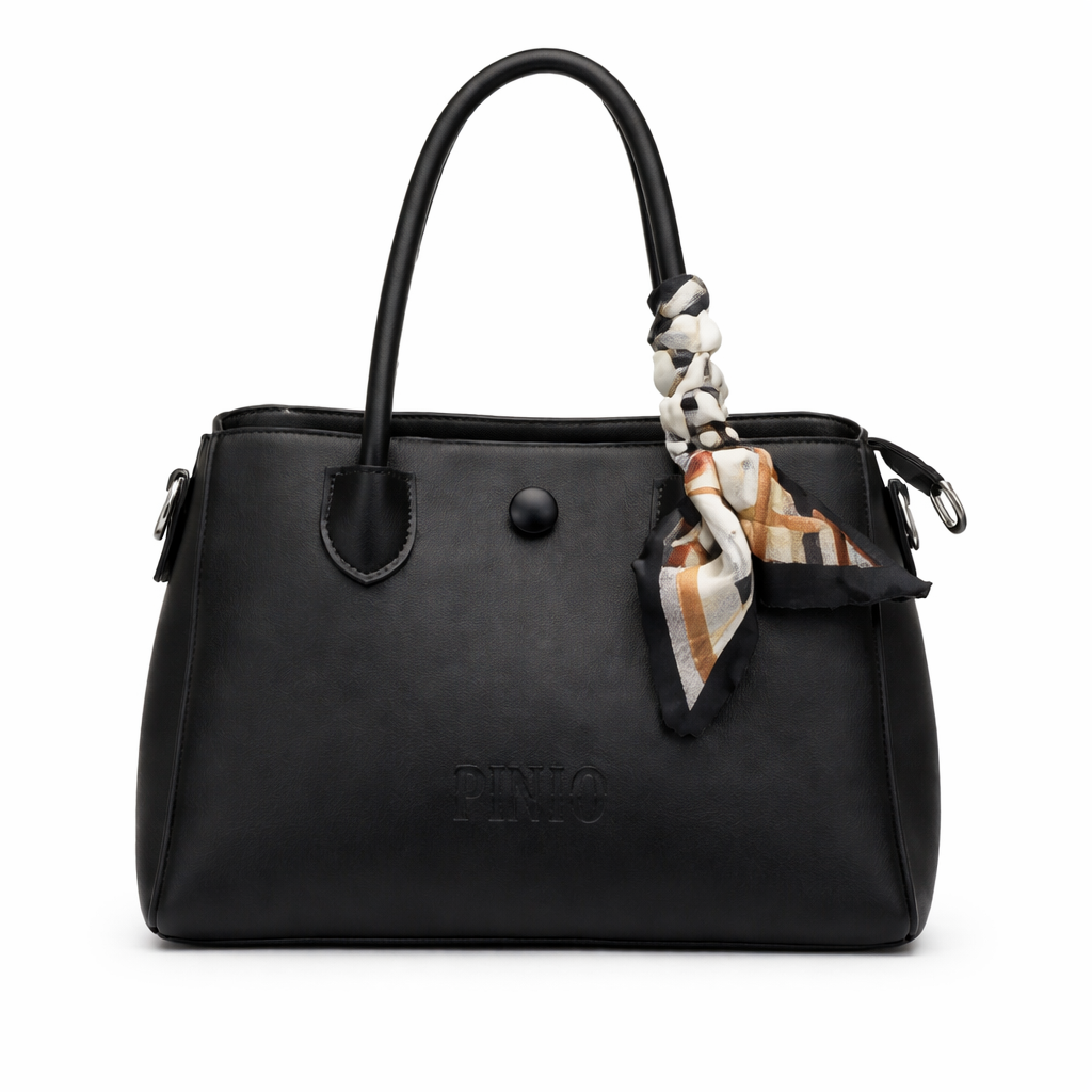 Black handbag with a plaid scarf attached on a white background