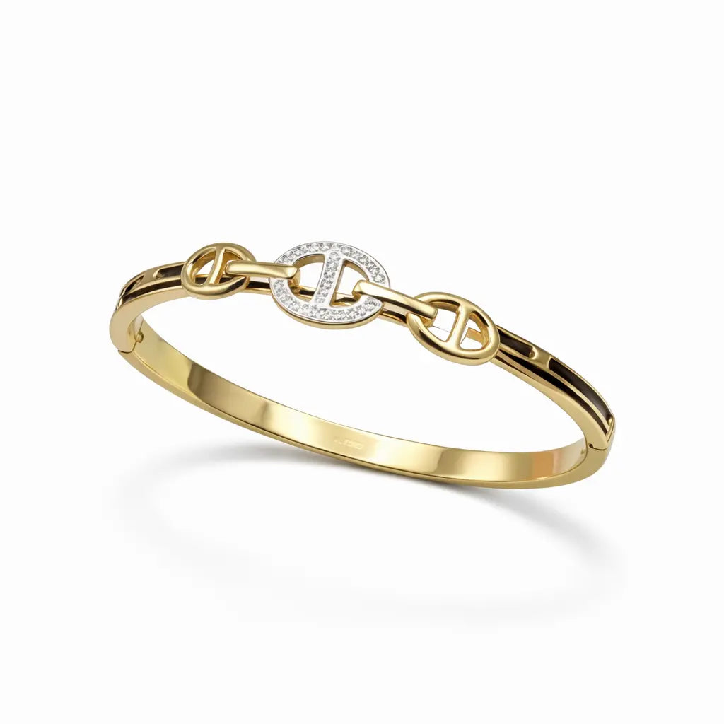 Gold bracelet with interlocking design on a white background