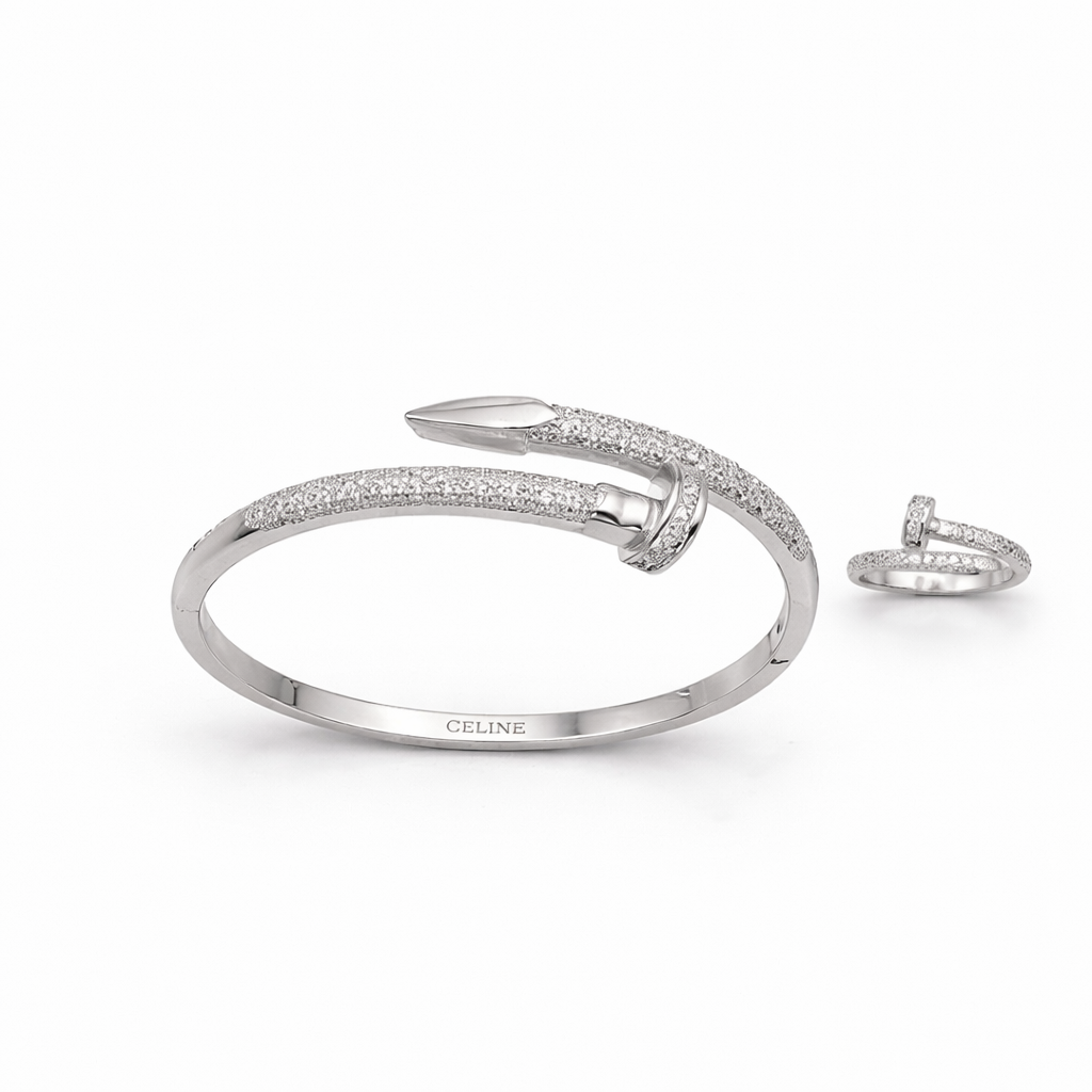 Silver bracelet and ring set with 'Celine' branding on a white background