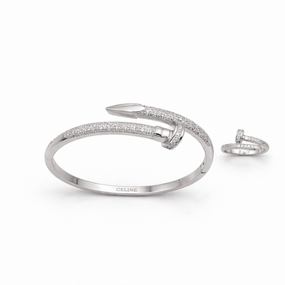 Silver bracelet and ring set with 'Celine' branding on a white background