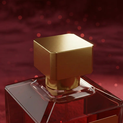 Gold and clear perfume bottle on a red background