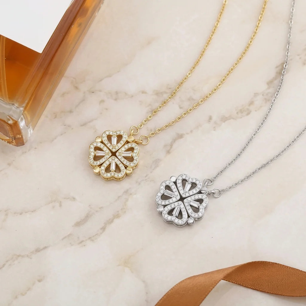 Two necklaces with floral pendants on a marble surface.