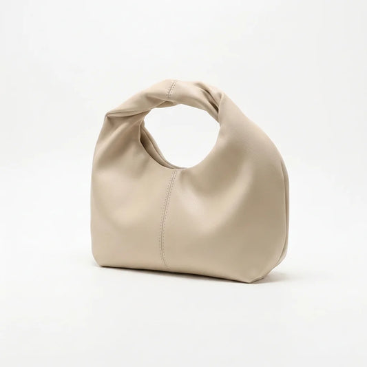 Beige handbag on a white background