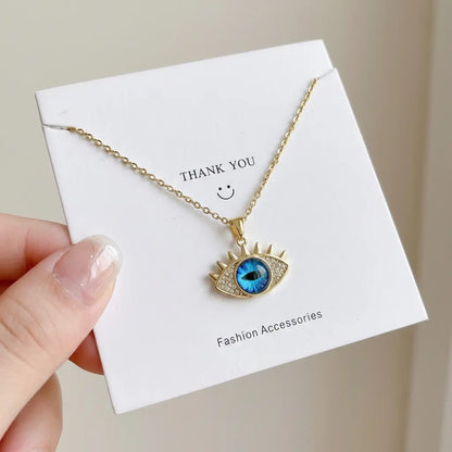 Necklace with eye-shaped pendant on a 'Thank You' card