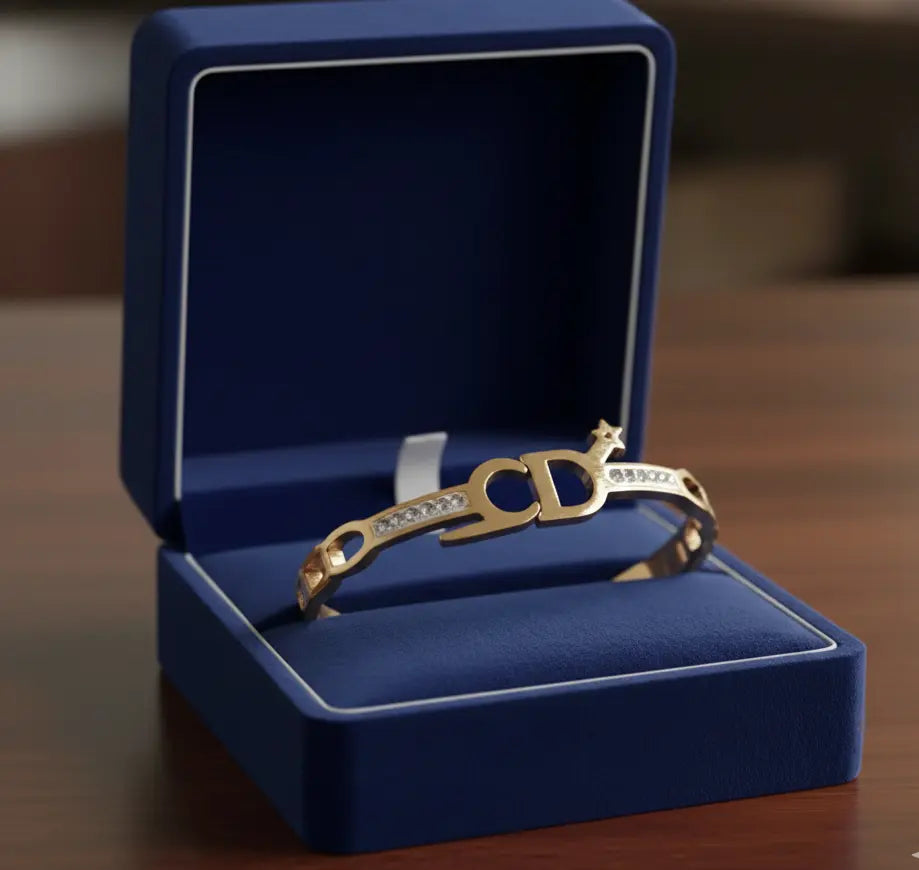 Gold bracelet with diamonds in a blue jewelry box on a wooden surface