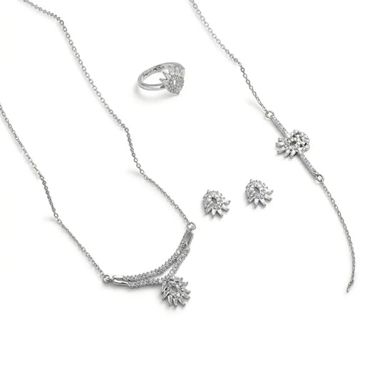 Silver jewelry set with necklace, ring, and earrings on a white background