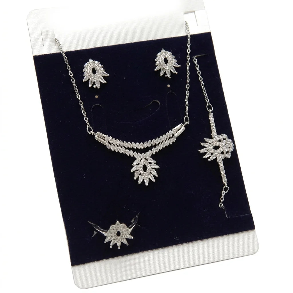 Silver jewelry set with necklace and earrings on a black display card.