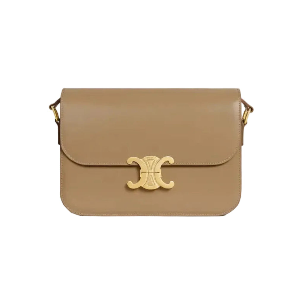 Beige handbag with a gold clasp on a light gray background
