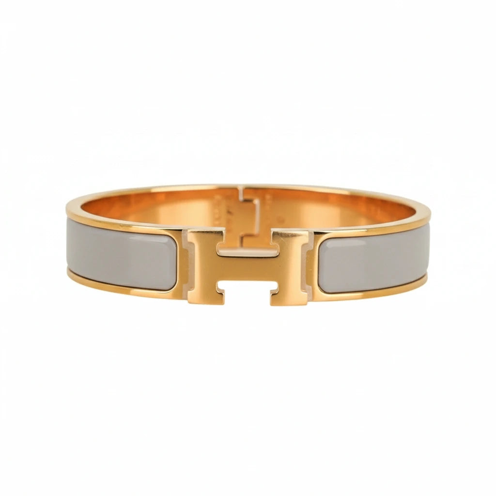 Gold and silver bracelet on a white background