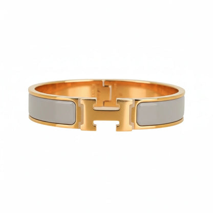 Gold and silver bracelet on a white background