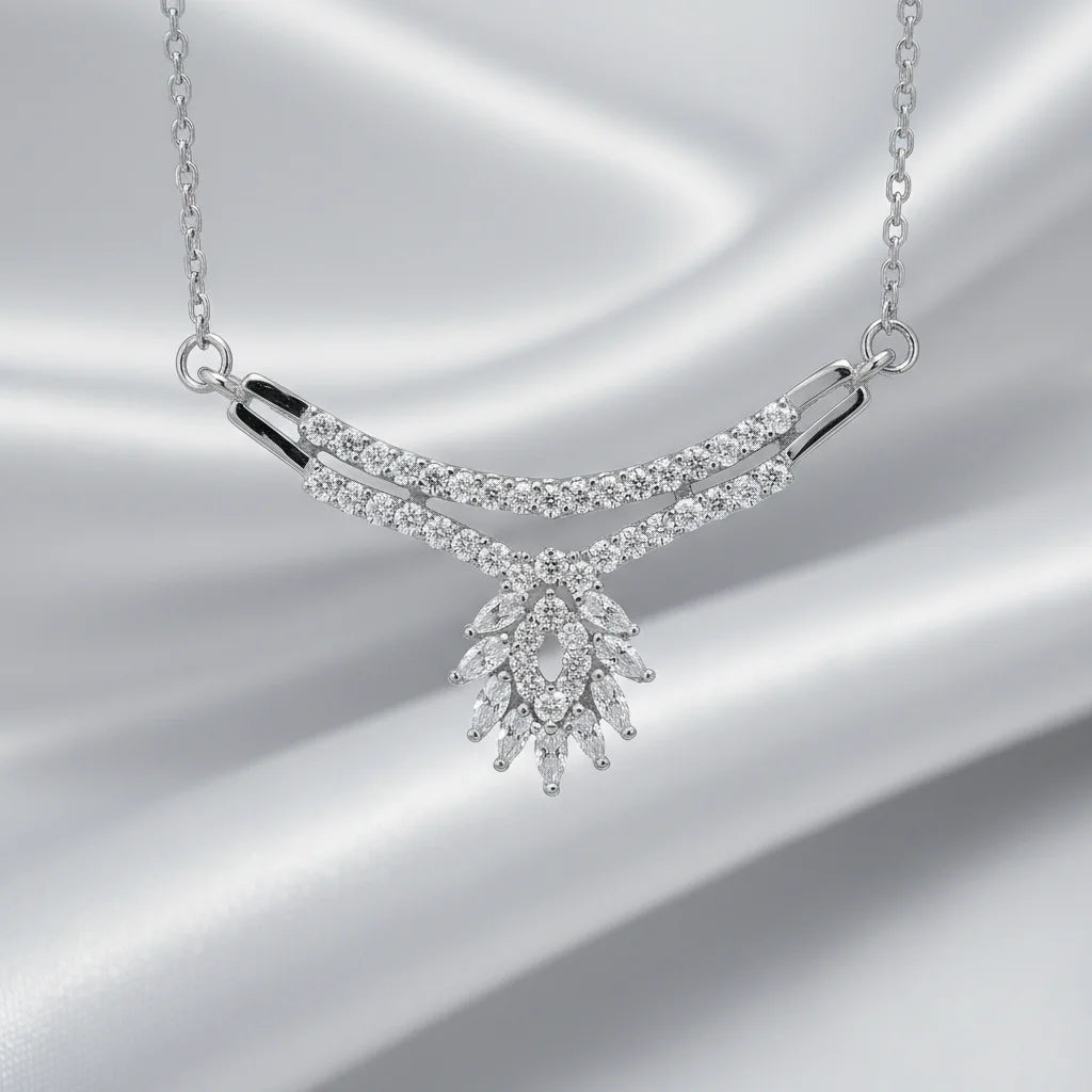Silver necklace with diamond-like stones on a silver background