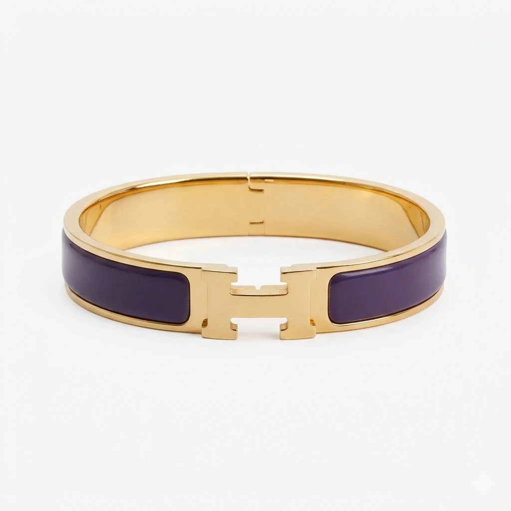 Gold bracelet with beige accents on a white background purple