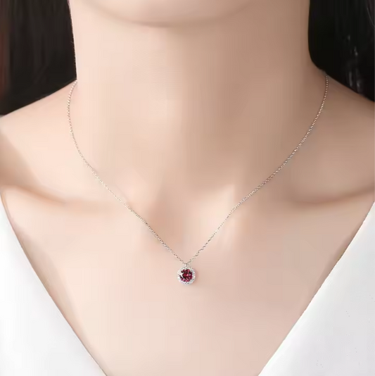 Necklace with a red gemstone pendant on a mannequin