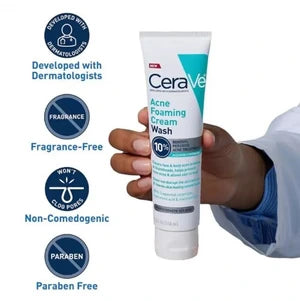 CeraVe acne foaming cleanser wash tube held by a person, with product features listed.