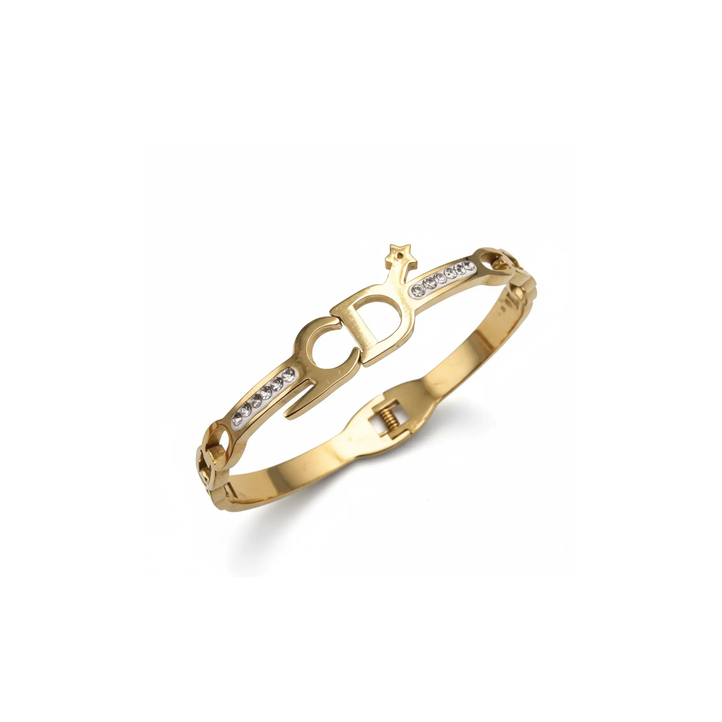 Gold bracelet with diamond accents on a white background