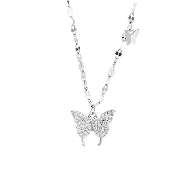 Butterfly necklace with clear stones on a white background