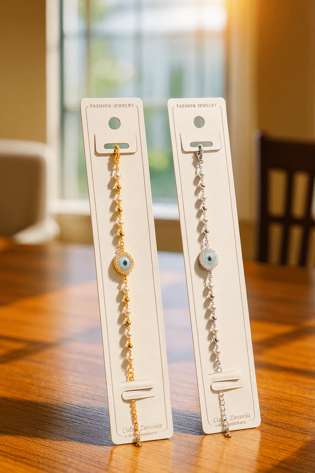 Two bracelets on display cards on a wooden surface with a blurred background